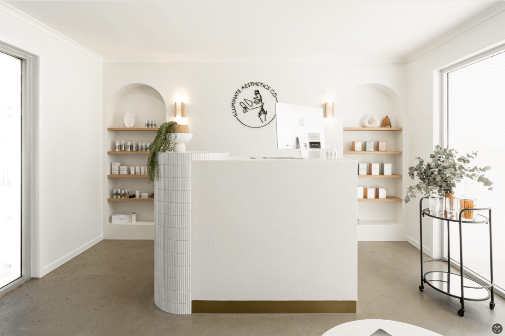 Frosted glass for privacy, neutral white colour palette and white subway tile reception counter for this wellness & beauty fit out for Illuminate Aesthetics